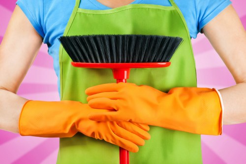 Cleaning technician handling equipment and checking safety measures