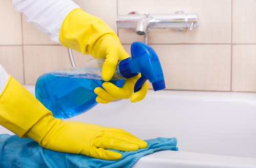 Office cleaning team working in a modern Acton workspace reception area