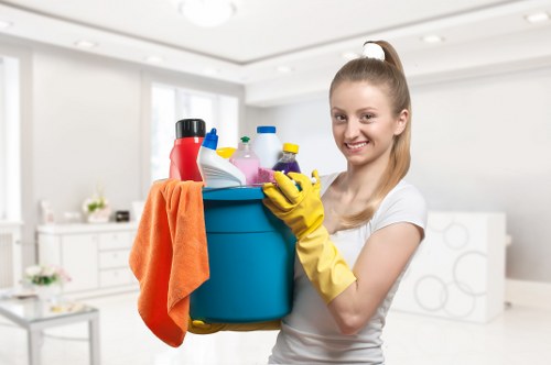 Technician cleaning a hallway carpet in an Acton property