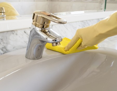 Carpet cleaning professional applying safe working methods